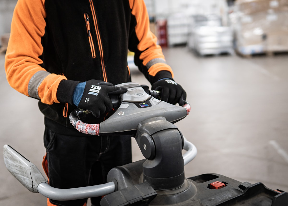 Worker driving a fork lift in ware house related to Enhancing Safety and Comfort with the KidCo Convertible Crib Bed Rail