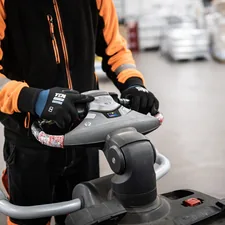 Worker driving a fork lift in ware house related to Enhancing Safety and Comfort with the KidCo Convertible Crib Bed Rail