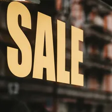 yellow sale text printed on glass window related to Window Valances on Sale