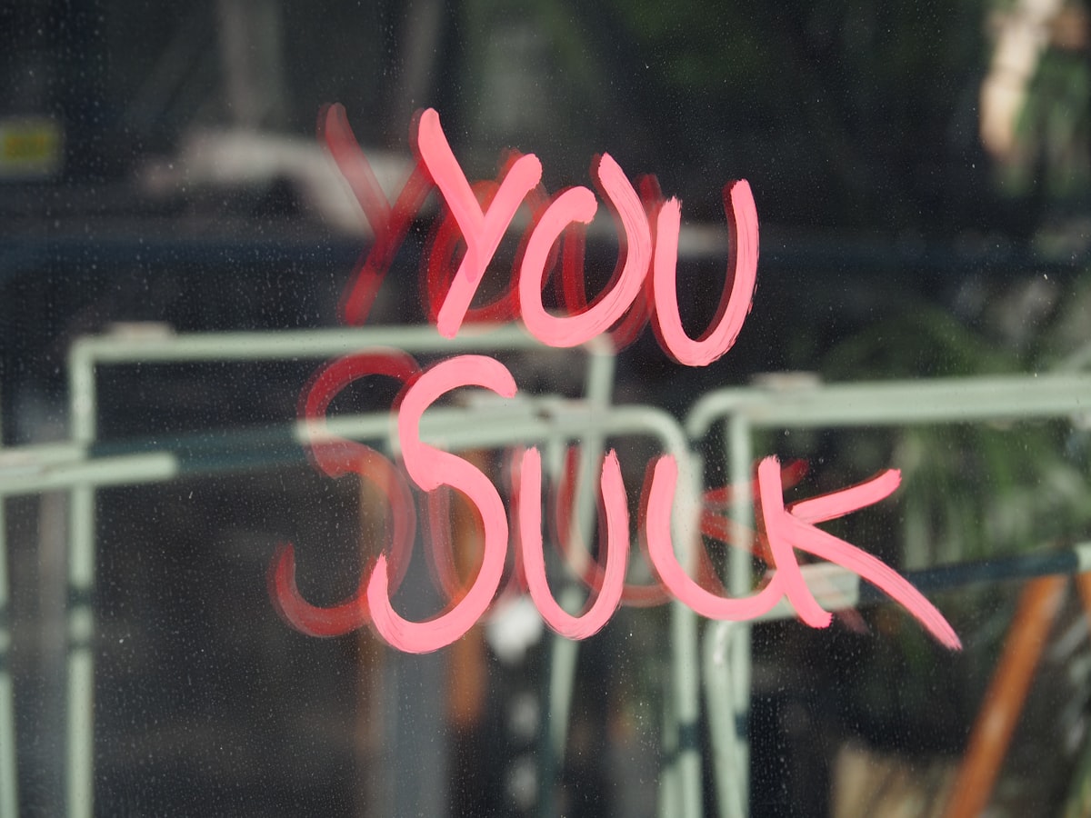 "You Suck" Glass Reflection. related to Can Bed Bug Bites Make You Sick? The Truth Behind the Itch